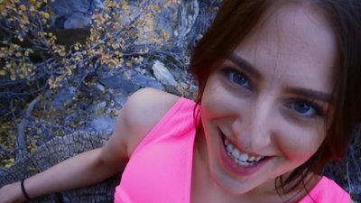 Rock climber can't take eyes off fuckable chick's ass covered with tight shorts. Youthful woman takes man with the camera somewhere into the distance